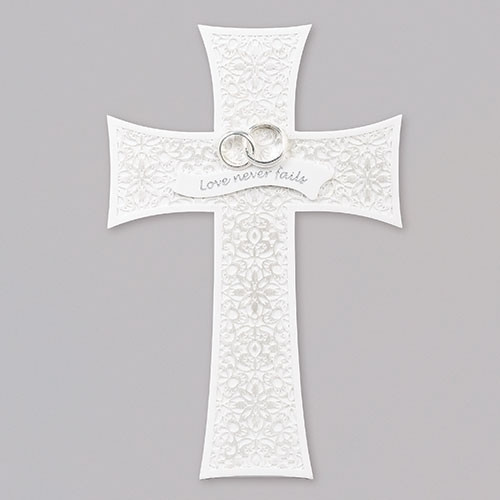 7.5"H  Wedding Lace look Wall Cross with two silver rings  and the words "Love Never Fails" attached on a banner across the middle of the cross.  The Lace look Wedding Wall Cross is made of a resin/stone mix and measures 7.5"H.
