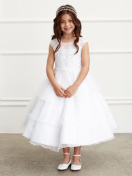 This gorgeous communion dress has an illusion neckline with a tulle 3 tier skirt. Appliques on bodice. Vee shaped in back with satin belt. Zipper closure.
30 Day Return Police Internet ONLY!
3 Dress Limit per Order!