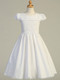 Smocked Cotton Communion Dress. This adorable smocked cotton communion dress has a cotton skirt and is tea length. Made in the USA