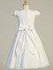 Smocked Cotton Communion Dress. This adorable smocked cotton communion dress has a cotton skirt and is tea length. Made in the USA