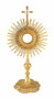  Golden monstrance with sun rays and a cross on top