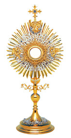 Trinity Monstrance - Depicts the Holy Trinity. Gold and Silver Plated, set with colored Stones. Base with enameled accents. Four layers of fililgree and rays with two angel figures. Gold rimmed glass luna for 2 3/4" Host. 31" High, carrying case included. Handmade in Poland. A full Luna can be added to monstrance at an addition price. *As some items are made to order, Please allow 4-6 weeks for delivery.