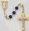 8 Millimeter Blue/Pearl Capped Rosary, Gold Plated Pewter Crucifix and Center. Deluxe Gift Box Included