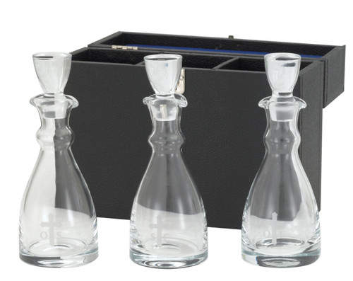 3 Piece Chrismatory Set with Carrying Case. Chrismal bottles are 8"H and hold 12 oz each. All glass is etched with OI, OS, & SC.  Carrying case measures: 11 3/8" x 4" x 9 1/8".  Note: glass may have slight irregularities.