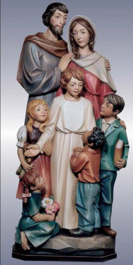 Sculpture of holy family embracing one another. 

