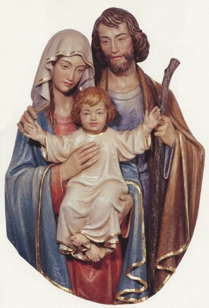 Colored wall relief of Virgin Mary and Saint Joseph holding Child Jesus