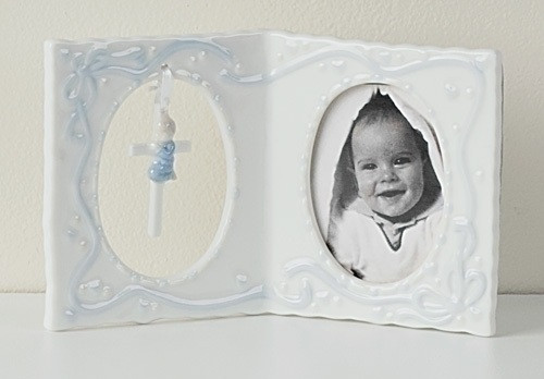 Porcelain Girl(pink)  or Boy(Blue) Baby Frame with Cross and holds a 2.5" x 3.5" photo.  Dimensions: 4"H x 6.25"W x 1.237"D. Gift Boxed
