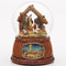 An image of the O Holy Night Nativity Snow Globe with a traditional Nativity scene within a globe filled with glitter and an illustration of Bethlehem at the base.