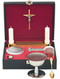 Stainless steel chalice with 3" cup, paten, oil stock, sprinkler, and host box. Removable tray with 7/8" socket. Gold spoon, wine bottle, and detachable crucifix. Complete with 8" x 10" x 2-3/4" case.