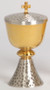 Gold plated, two-tone bright and satin finish cup and node. Silver plated hammered finish on base and lid. 7" height, 3-1/2" diameter cup, 3" base. 150 host capacity (Based on 1 1/8" Host). Complements Chalice 356
