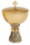 Gold plated with cast base, antique gold finish. 9" height, 5-1/2" diameter cup, 2 1/2" base. 500 host capacity (Based on 1 1/8" Host). Complements Chalice 2386-G

 