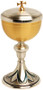 Gold plated and oxidized silver.
4" Base
8 1/4" height, 3 7/8" diameter cup.
200 host capacity (Based on 1 1/8" Host)
Complements Chalice 926

 