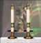 Two white Christus Rex altar candles with gold and green symbol at bottom of each candle. 


