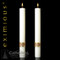 Image of two white tapered altar candles with a gold leaf band around the base.