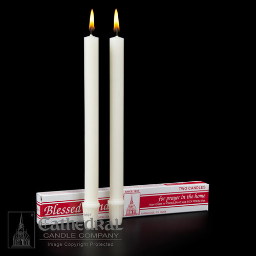 Two white candles side-by-side to use in one’s home. 
