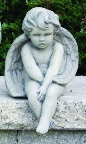 Statue of cherub sitting in a natural cement finish.
This sitting cherub statue can make an adorable addition to your garden. This statue features a cherub sitting with their ankles crossed and hands in their lap.
Dimensions: 12"H x 7.5"W
Weight: 14 lbs
Made to order
Made in the USA
Allow 4-6 weeks for delivery.

 