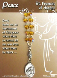 Saint for Peace and Patron Saint of Animals. Contains a prayer on the reverse side of the card.  4" long; medal is 1" x 5/8".