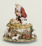 Kneeling Santa w/ Jesus ~ Musical  "O' Come All Ye Faithful". 5.75"H x 5.5"W x 5.5"D. Resin/Stone Mix