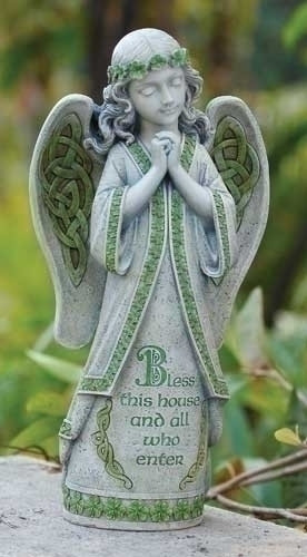 Garden statue of an Irish angel with house blessing inscribed on the front.