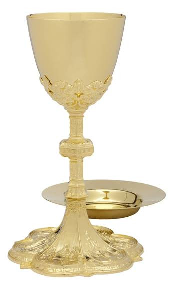 Chalice is 24K Gold plate with a decorative metal base, stem & node. Chalice is 10"Ht., and holds 13 oz. Chalice comes with 6 3/8" deep well paten. Made in the USA
