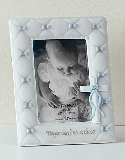 7" Baptism Frame for a Boy or Girl. This Blue or Pink Baptism Frame holds a 3.5"H x 5"W photo. The Baptism Frame measures 7"H x 5.5"W x .5"D. The Baptism Frame is made of a resin/stone mix and glass. The Baptism Frame complements Baptism Wall Cross (42828)