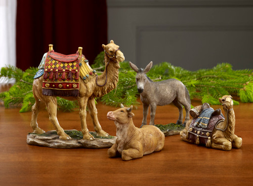 Image of the Three Kings Nativity Animals 4pc Set including a standing camel, sitting camel, donkey, and ox.