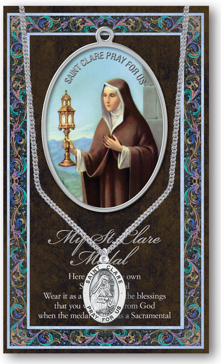 St. Clare, Patron Saint of Eye Disorders and Television. A 1.125" Genuine Pewter Medal with Stainless Steel Chain. Gold Embossed  Prayer Card included with short biography of the saint included. (3.25"x 5.5")