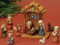 Close-up image of the figures and stable included in the Children's Nativity Set With Stable.