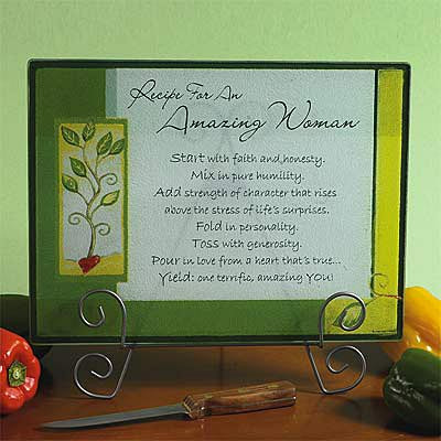"Amazing Woman" Tempered glass cutting board is heat safe up to 248°F. Boxed. 15 5/8" x 11 3/4".  Cutting Board that has this recipe:   "Start with faith and honesty. Mix in humility. Add strength of character that rises above the stress of life's surprises. Fold in personality. Toss with generosity. Pour in love from a heart that's true...Yield: One terrific, amazing you!"Does not come with stand