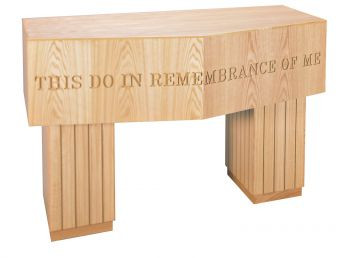 This Communion Table has contemporary design elements. The 3700 Series communion table is crafted using red oak and red oak veneer. Communion table with or without  lettering.  Dimensions: 35" height, 60" width, 30" depth