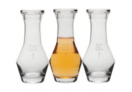 Glass Chrismal Set - Bottles hold 40 Oz and are in 10 3/4"H. all bottles are eetched with OI, OS, & SC. Note: all glass may have slight irregularities.