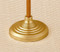 Image of a gold processional base with sleek ridge detailing.