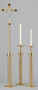 Satin brass finish with bronze lacquer standard, wood accents on cross. All pieces removable at mid-point. Corpus measures 12" in height.  Plastic sleeve for cross shaft is included. Weighted base.Matching Sanctuary Appointment Set Set with Standard Paschal Stand Set with Short Paschal Stand.
