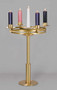 The Brass and Satin Polished Church Advent Floor Wreath, adorned with five advent candles.