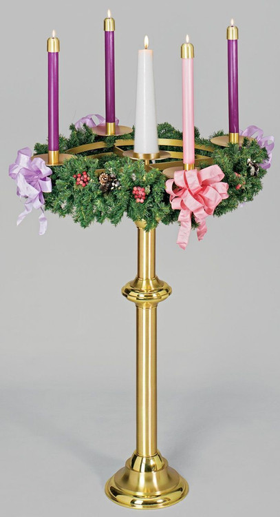 The Advent Floor Candle Holder, decorated with a wreath and candles.