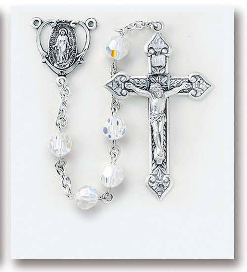 8mm Aurora Sphere Shaped Swarovski Crystal Beads. All Sterling Silver Findings with Sterling Silver Miraculous Center and 2" Sterling Silver Crucifix. Sterling Silver Centerpiece and crucifix with rhodium plated brass findings. Deluxe Velour Gift Box Included. Made in the USA of solid sterling pins, chain, beads, centers, and crucifixes.