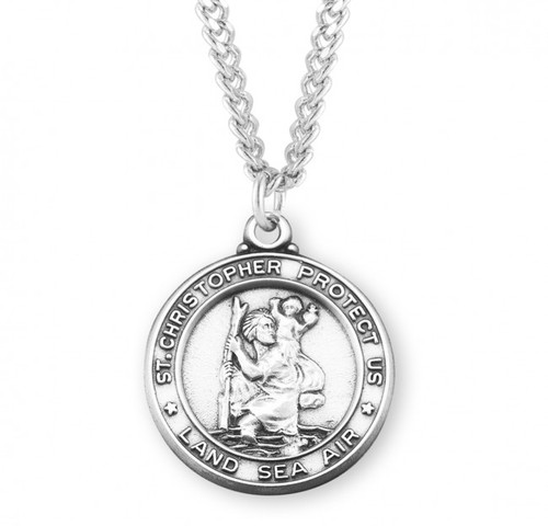 1-5/16" Round Sterling Silver St. Christopher Service Medal. "Saint Christopher Protect Us. Land, Sea, Air".  Medal comes on a  24" genuine rhodium plated curb chain. A deluxe velour gift box is included. Dimensions: 1.3" x 1.1" (32mm x 28mm).  Made in the USA. 