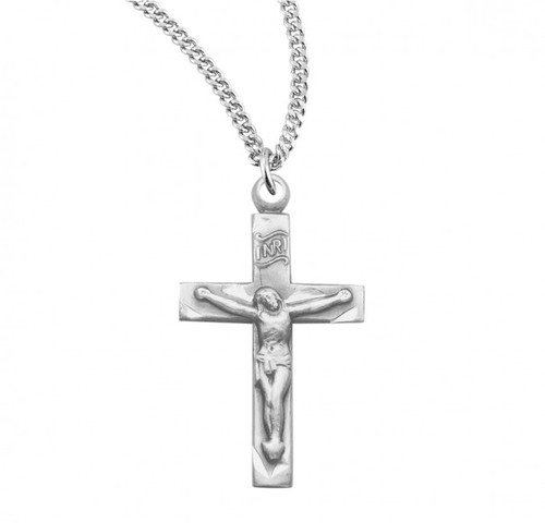 13/16" Basic narrow  sterling silver crucifix. Crucifix comes on an 18" Genuine rhodium plated curb chain. Dimensions: 1.0" x 0.5" (25mm x 13mm). Crucifix comes in a deluxe velour gift box. Made in USA.