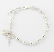 5mm High Polished Round Sterling Silver Beads Rosary Bracelet with Sterling Silver Miraculous Medal and Crucifix. Comes in a deluxe velour gift box. Made in the USA. 