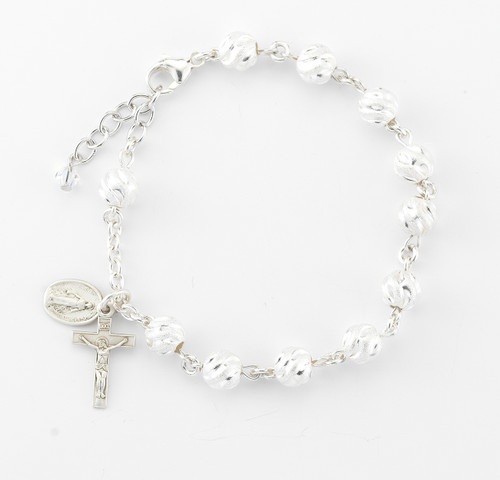 All Sterling 7mm Round Swirled Semi Frosted Sterling Silver Beads with Sterling Miraculous Medal and Crucifix. Rosary bracelet comes in a deluxe velour gift box. Made in the USA.