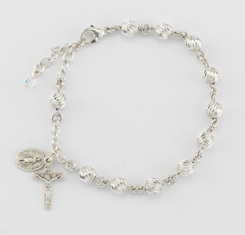 6mm Sterling silver swirl corrugated beads with sterling silver Miraculous Medal and Crucifix made with all sterling findings. Comes in a deluxe velour gift box. Made in the USA.