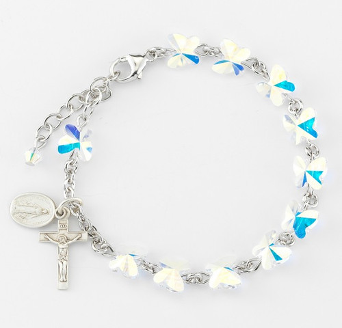 8mm Swararovski crystal butterfly shaped beads rosary bracelet. Sterling Silver Miraculous Medal and Crucifix with sterling silver links and chain or rhodium plated brass links and chain. Comes in a deluxe velour gift box. Made in the USA.