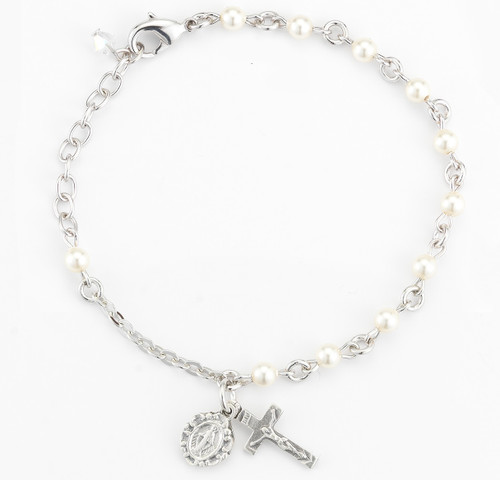 Rosary bracelet with 4mm Swarovski Imitation White Pearl beads. Rhodium plated brass findings. Silver oxidized miraculous medal and crucifix. Available colors: white, beige, blue, lavender, and pink. Comes with a deluxe velour gift box. Made in the USA.
