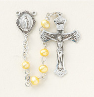 Gold Freshwater Pearl Beads ~ Rosary made with 4mm freshwater pearl beads. Rhodium plated brass wire and chain. Exclusive designed sterling silver small ornate Miraculous Medal centerpiece and sterling silver 1-1/4”crucifix. Handmade in the USA by expert New England Silversmiths. Presented in a deluxe velour metal gift box.  Available in Blue, Pink, Lavender, and Gold pearl beads. 