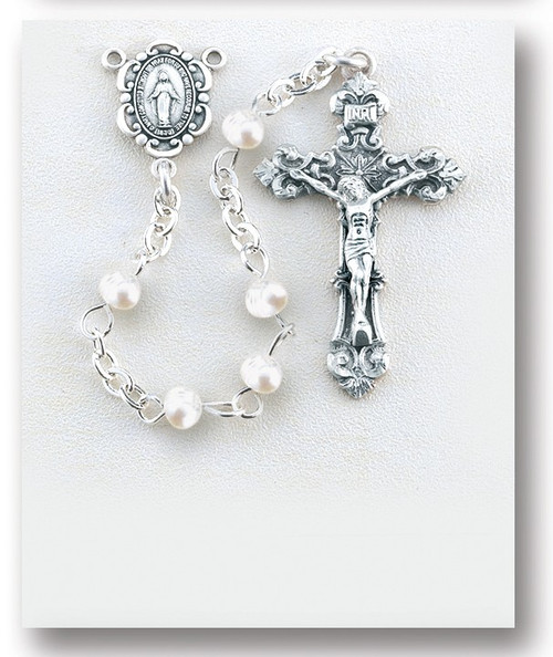 White Freshwater Pearl Beads ~ Rosary made with 4mm freshwater pearl beads. Rhodium plated brass wire and chain. Exclusive designed sterling silver small ornate Miraculous Medal centerpiece and sterling silver 1-1/4”crucifix. Handmade in the USA by expert New England Silversmiths. Presented in a deluxe velour metal gift box.  Available in Blue, Pink, Lavender, and Gold pearl beads. 