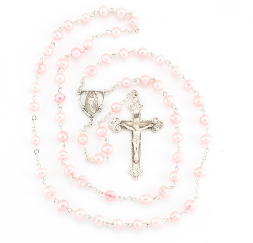 Rosary made with 6mm freshwater pearls. Pink pearl rosary has a detailed sterling silver Miraculous Centerpiece with a 1-7/8" sterling silver Crucifix. Rhodium plated brass findings. Rosary comes with a deluxe velour gift box. Made in the USA.