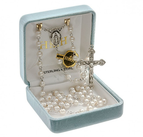 Rosary with 5mm double capped Imitation Pearl Beads. Sterling silver Miraculous Center and 1-11/16" sterling silver Crucifix. Rhodium plated brass findings. Comes with a deluxe velour gift box. Made in the USA.