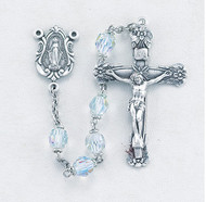 Clear Aurora- Rosary with 6mm tin cut czech crystal aurora beads with sterling silver miraculous center and 1-3/4" sterling crucifix. Rhodium plated brass findings. Crystal color choices: clear, light rose, carribean blue, light sapphire, aqua, and amethsyt. Comes with a deluxe velour gift box. Made in the USA.