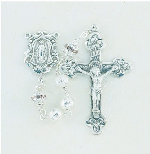6mm Silver Frosted Beads with Pink Multi Crystal Capped "Our Father" Beads. Solid brass findings, pins and chain with genuine rhodium plating to prevent tarnishing. Exclusively designed sterling silver Miraculous Center and 1-3/4" sterling silver Crucifix. Deluxe velour gift box included. Made in the USA. 