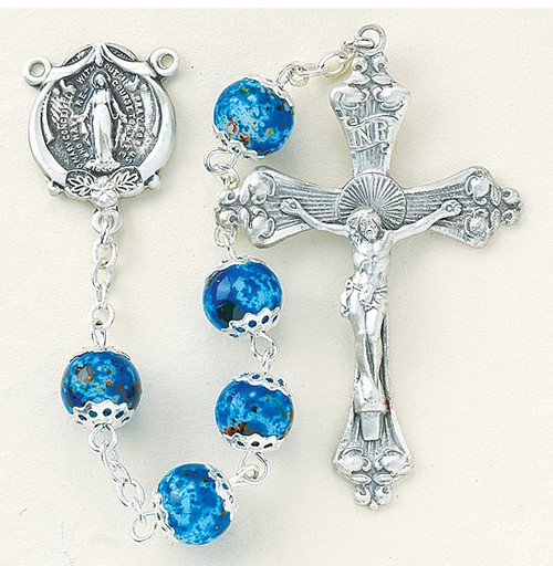 8mm Blue or Pink Marble Double Capped Glass Beads. Solid brass findings, pins and chain with genuine rhodium plating to prevent tarnishing.  Exclusively designed Sterling Silver Miraculous Center and 2" Sterling Silver Crucifix. Deluxe Velour Gift Box Included.  Made in the USA!